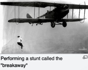 Lillian Boyer in her "breakaway" stunt in which she climbs down a ladder and then hangs upside down from it while the airplane flies on. Courtesy alamy.com