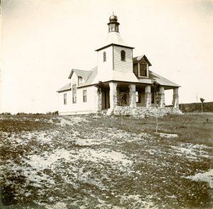 A rare early photo of Omena Congregational Church from the archives of Omena Historical Society.