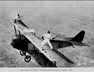 Gladys Roy playing tennis while wing walking. She famously once said, “Of late the crowds are beginning to tire of even my most difficult stunts and so I must necessarily invent new ones if I want to hold my reputation as a daredevil. Google Image