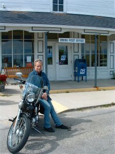 Mark Frank and his motorcycle in front of the Post Office when he was Postmaster. -  Photo courtesy of Mark