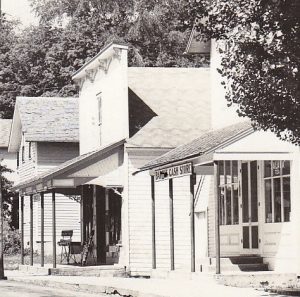 Omena's Post Office next to Barth's Cash Store in an early photo. - Courtesy Omena Historical Society