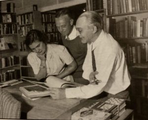 Will Solle with his customers and books in 1941. Courtesy Leelanau Historical Society