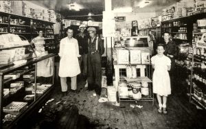 Kimmerly's Grocery Store, on an unusually chaotic day in 1950. The glass case on the left is still used by Tamarack to show Jewelry. Photo courtesy David and Sally Viskochil