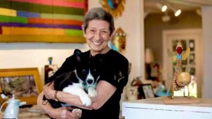 Sally holds Bobby the Dog at the Gallery in August of 2022. Photo courtesy Record Eagle/Mike Krebs